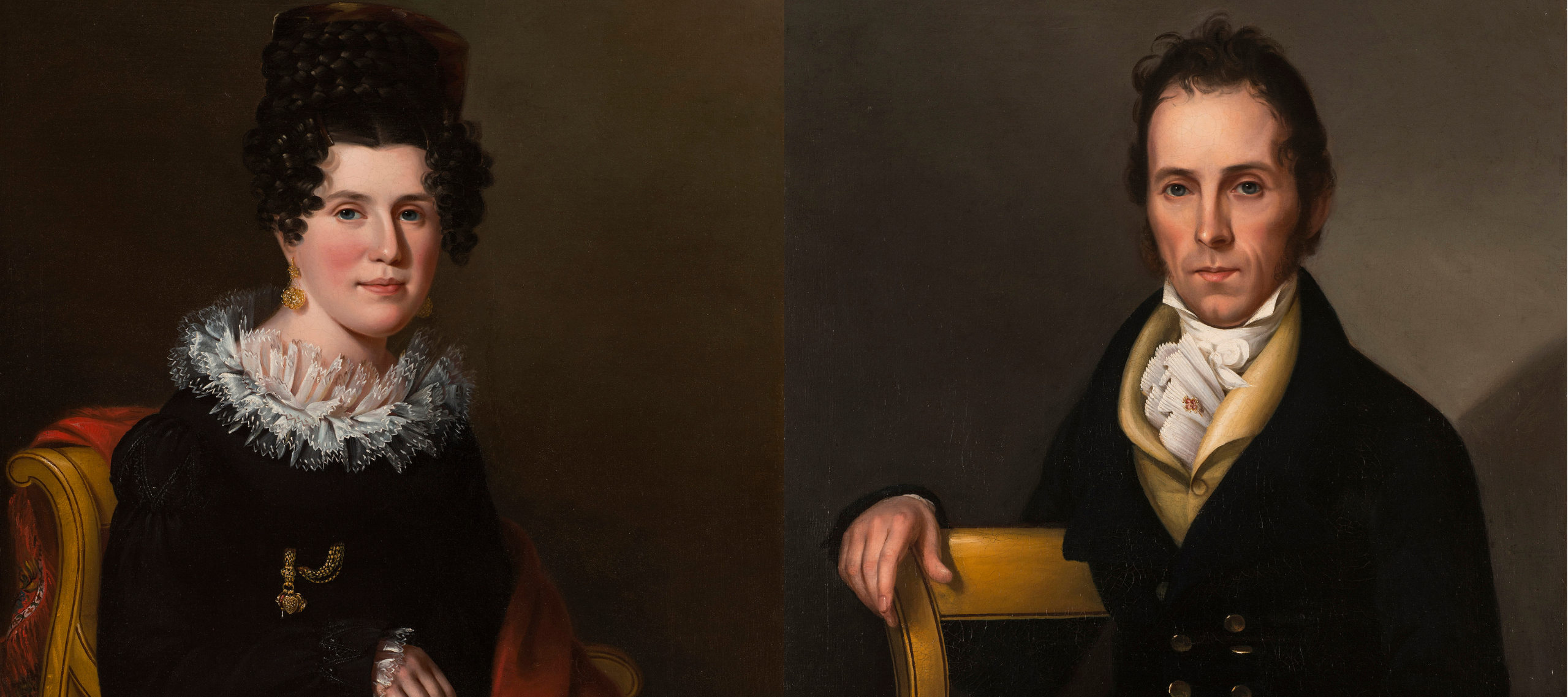 Side-by-side portraits of a light-skinned couple with dark hair sitting in formal postures. Gazing outward, they wear dark clothing with light accents and the woman wears a gold earring and pin. They both hold objects: the woman a brocaded red cloth and the man a book.