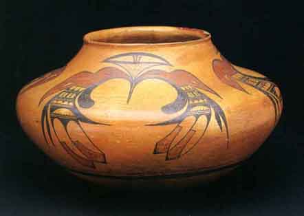 Brown bowl with illustrations of an eagle tail.