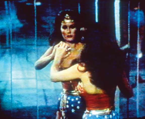 Film still of a woman dressed as wonder woman.