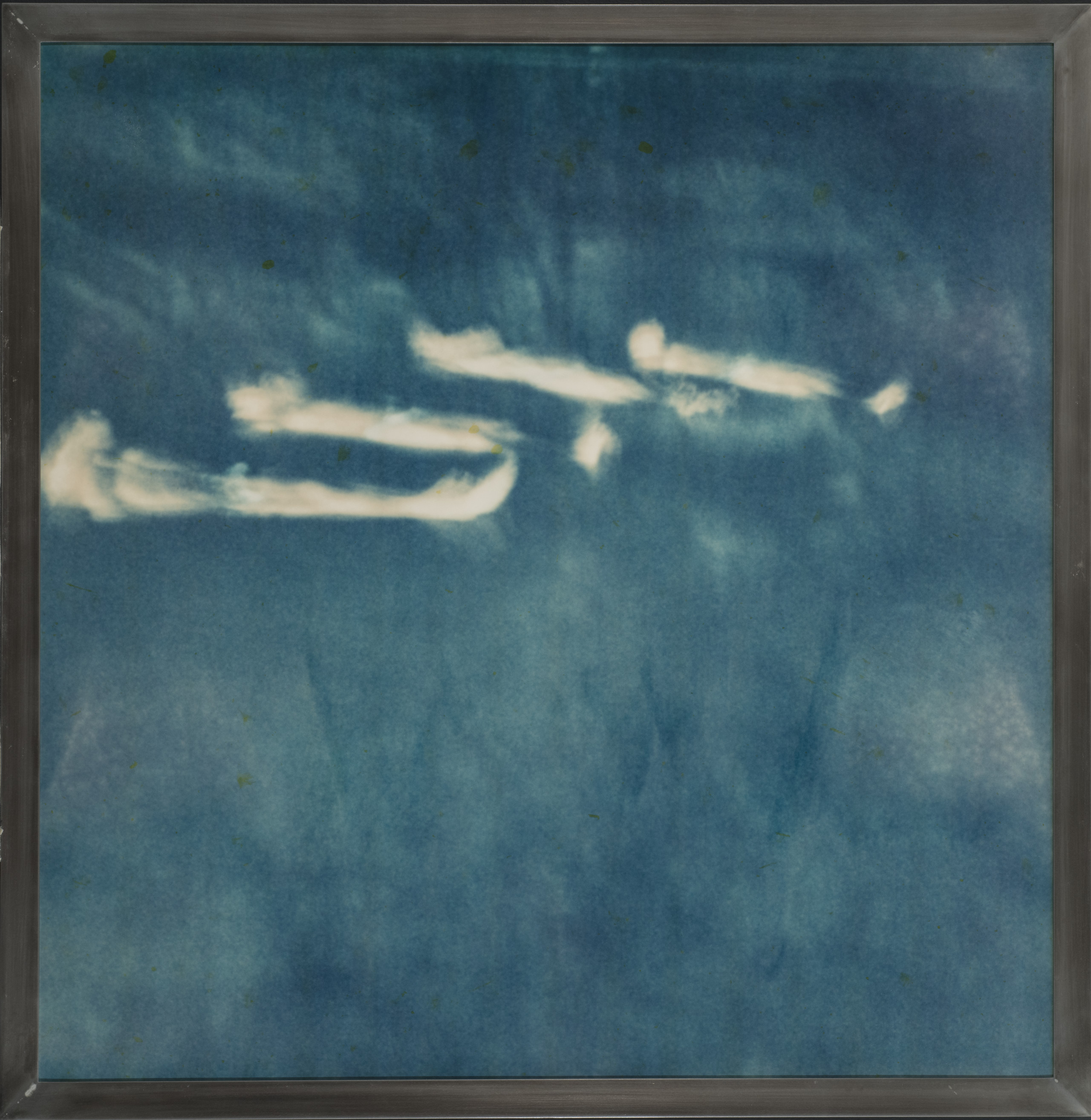 Four long, white, cloudy-looking wisps against a cyan navy background.
