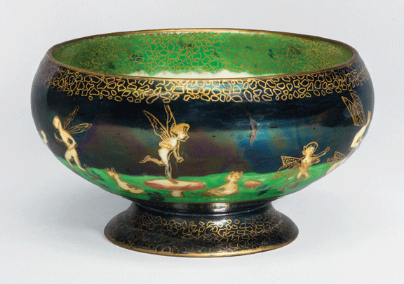 A shiny bowl with vibrant blues, greens, and gold accents with a wide opening and edges in gold, as well as illustrations of little fairies.