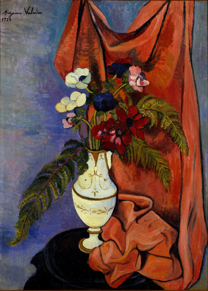 Painting of a white vase with gold embellishments holding a bouquet of eight flowers and a few leaves. The colorful flowers have long stems and are humble in size, and stand before a blue wall and red sheet in the background. The sheet hangs down, tumbling into a heap next to the vase.