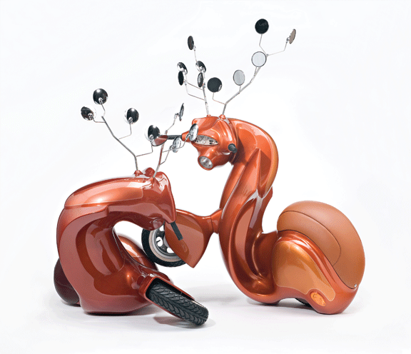 A sculpture consists of two metallic-orange motor scooters manipulated to resemble male deer. Leather seats become haunches, dashboard dials resemble faces, and multiple rear-view mirrors morph into antlers. The serpentine, hybrid animal-machines appear to spar for dominance.