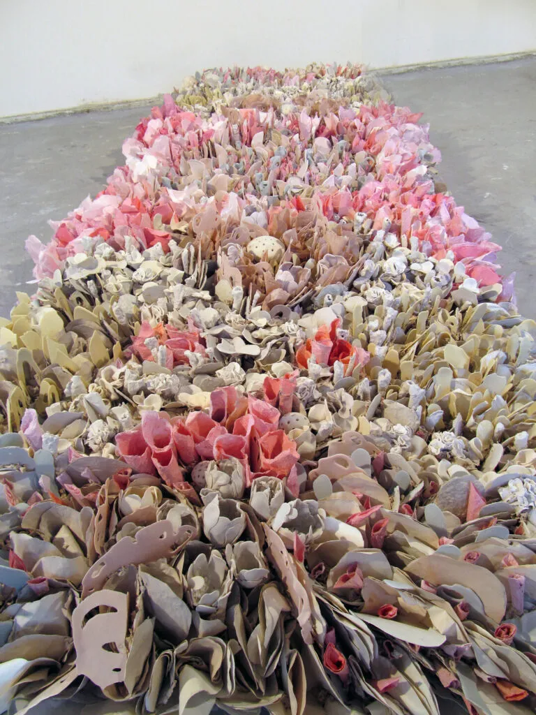 Rebecca Hutchinson, Patterns of Nature, Pink, 2014; Fired and unfired porcelain paper clay, handmade paper, organic material, 36 x 108 x 8 in.; National Museum of Women in the Arts, Gift of the artist