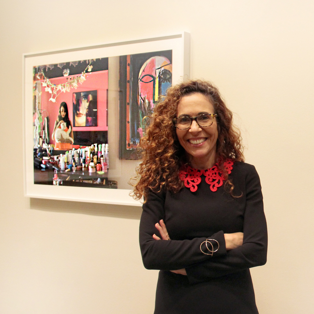 Rania Matar at NMWA in front of one of her photographs in She Who Tells a Story; Photo: NMWA
