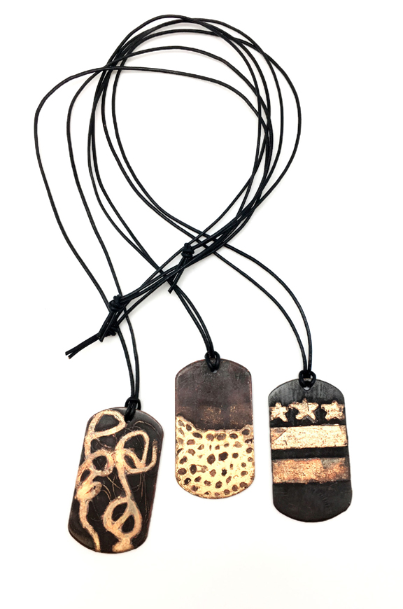 NMWA Limited-Edition Etched Dog Tags by Sharlaine Anapu
