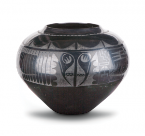 Blackware pottery vessel with a wide mouth and bulbous body that tapers to a narrow base. The pot is adorned with geometric tribal patterns presented in a matte finish on the glossy surface.