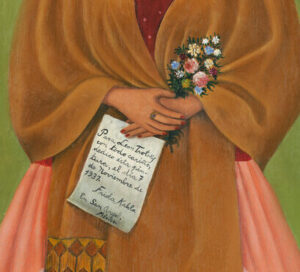 In a painted self-portrait, the artist stands in a stage-like space framed by white curtains. Beneath black hair woven with red yarn and flowers, heavy brows accent her dark-eyed gaze. Clad in a fringed, honey-toned shawl; long, pink skirt; and gold jewelry, she holds a bouquet and a handwritten letter.
