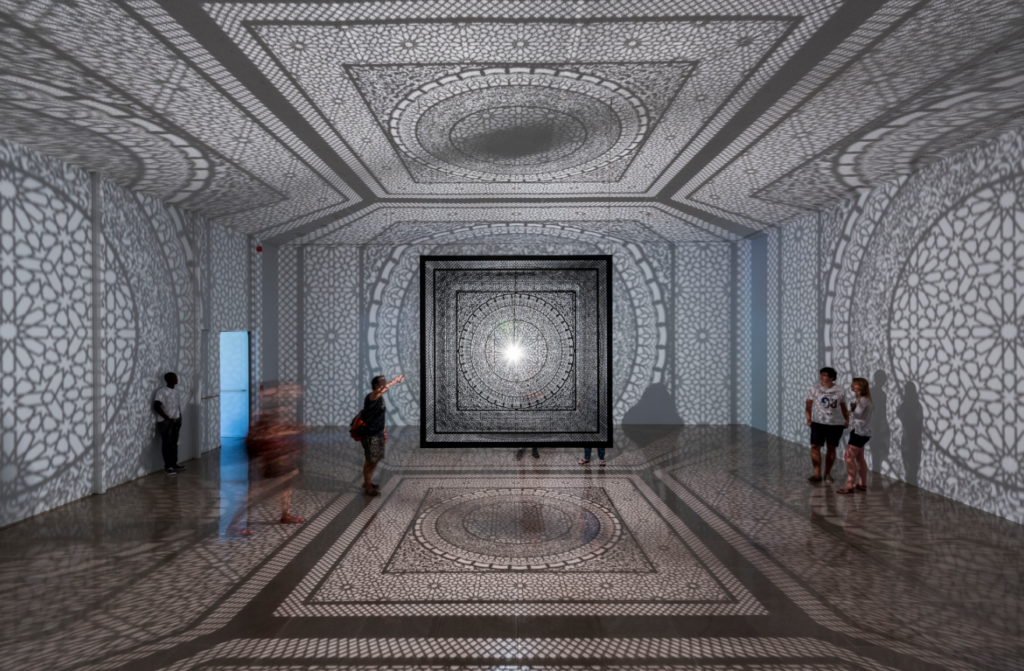 People experience Anila Quayyum Agha's installation Intersections, 2013; Site-specific installation at Rice University Art Gallery, 2015