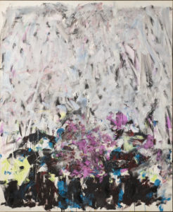 A vertical, abstraction features broadly painted strokes of pale gray, lavender, and cobalt in the upper two-thirds of the canvas. The colors continue in the lower third, along with touches of green, black, and other hues, but the expressive brushwork becomes denser and chaotic.