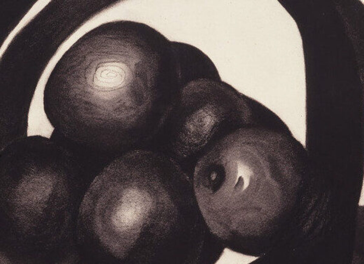 A still life of avocados in a basket rendered in charcoal on a white ground uses radically simplified forms. Two offset circles evoke a basket and its shadow. Within the circles, ovals highlighted to imply 3 dimensions, seem to hover above, not sit within, the basket interior