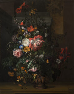 A still life painting featuring an asymmetrical arrangement of flowers; the central section features pink, orange, yellow, and blue flowers and is dramatically highlighted compared to the background and outer edge of arrangement.