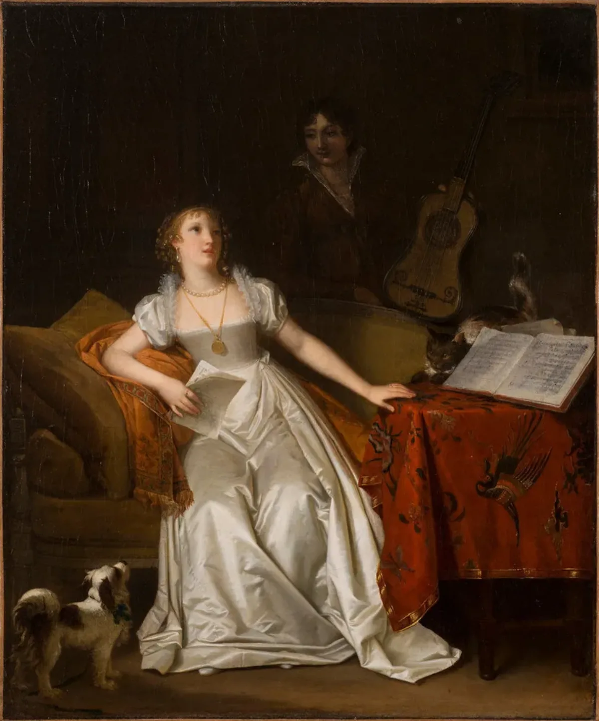 A blonde, light-skinned woman in a white satin gown holds music and sits on a settee. Bright light accentuates the singer, casting the dark-haired woman standing behind her with a guitar into murky shadow. A cat crouches on a music-strewn table, staring at the pert lapdog below.