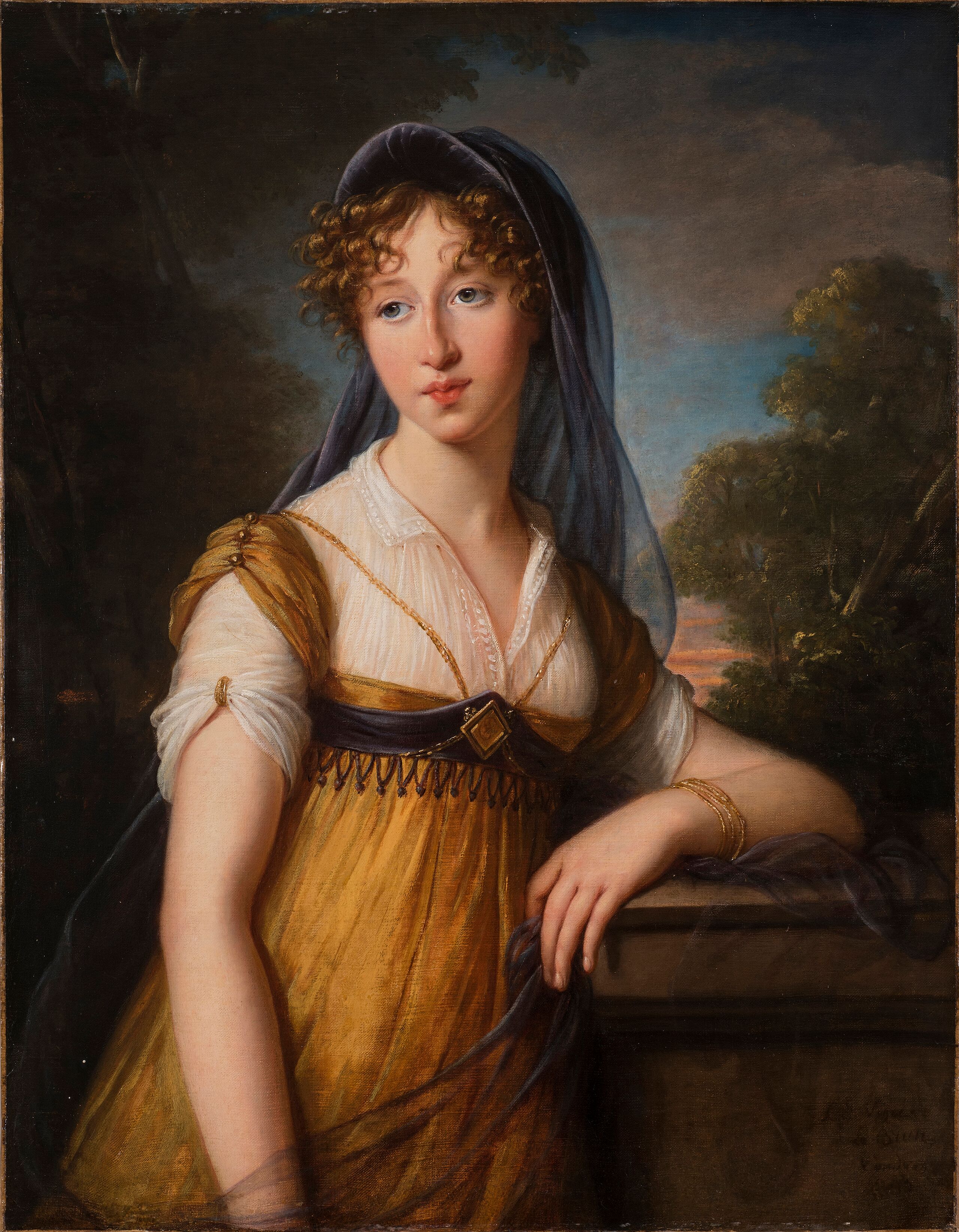 Realistically rendered half-portrait of a young woman with light skin tone leaning casually against a stone garden wall with trees and sky in the background. She is wearing a gold-and-white flowing dress with a dark blue veil draped loosely over her curly light-brown hair.