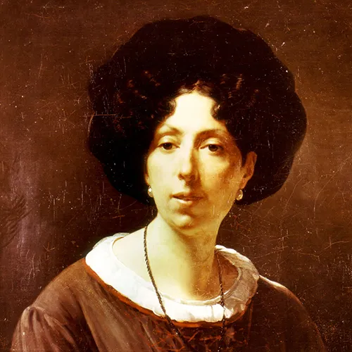 Painting of a light-skinned adult woman with dark eyes and dark, curled hair styled neatly away from her face and tucked under a large hat. She wears earrings and a necklace, along with a loose brown top with a pleated white collar.