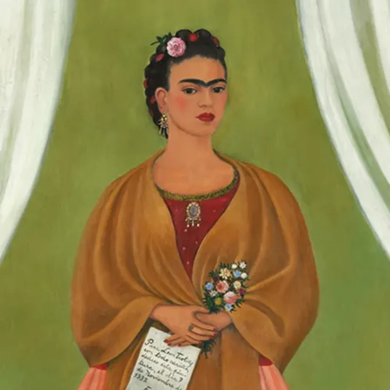 The artist stands in a stage-like space framed by white curtains. Beneath black hair woven with red yarn and flowers, heavy brows accent her dark-eyed gaze. Clad in a fringed, honey-toned shawl; long, pink skirt; and gold jewelry, she holds a bouquet and a handwritten letter.