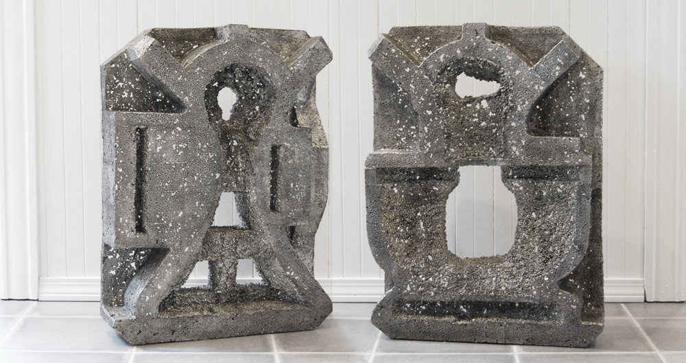 Two large pewter casts of styrofoam from a Kitchenaid mixer, side by side