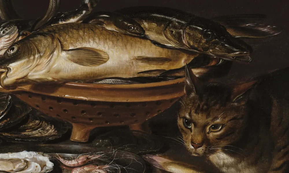 Still life painting features a reddish ceramic colander with several types of fish. In the foreground, a cat stands alert next to shrimp and oyster shells on a gleaming pewter dish.