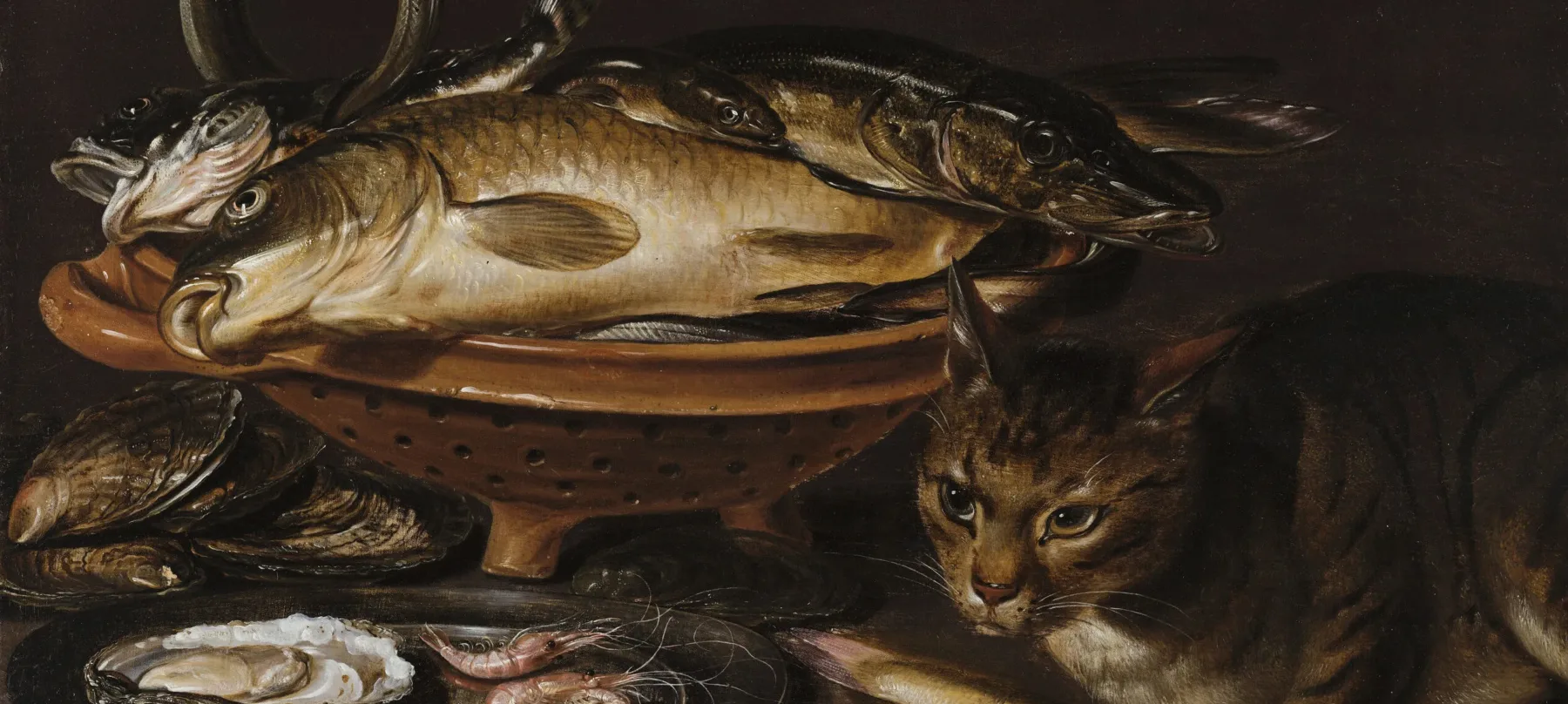 A still life painting featuring a bowl of dead fish, silver platter with an oyster and shrimp, and a cat with a fish in its paws sitting next to it.