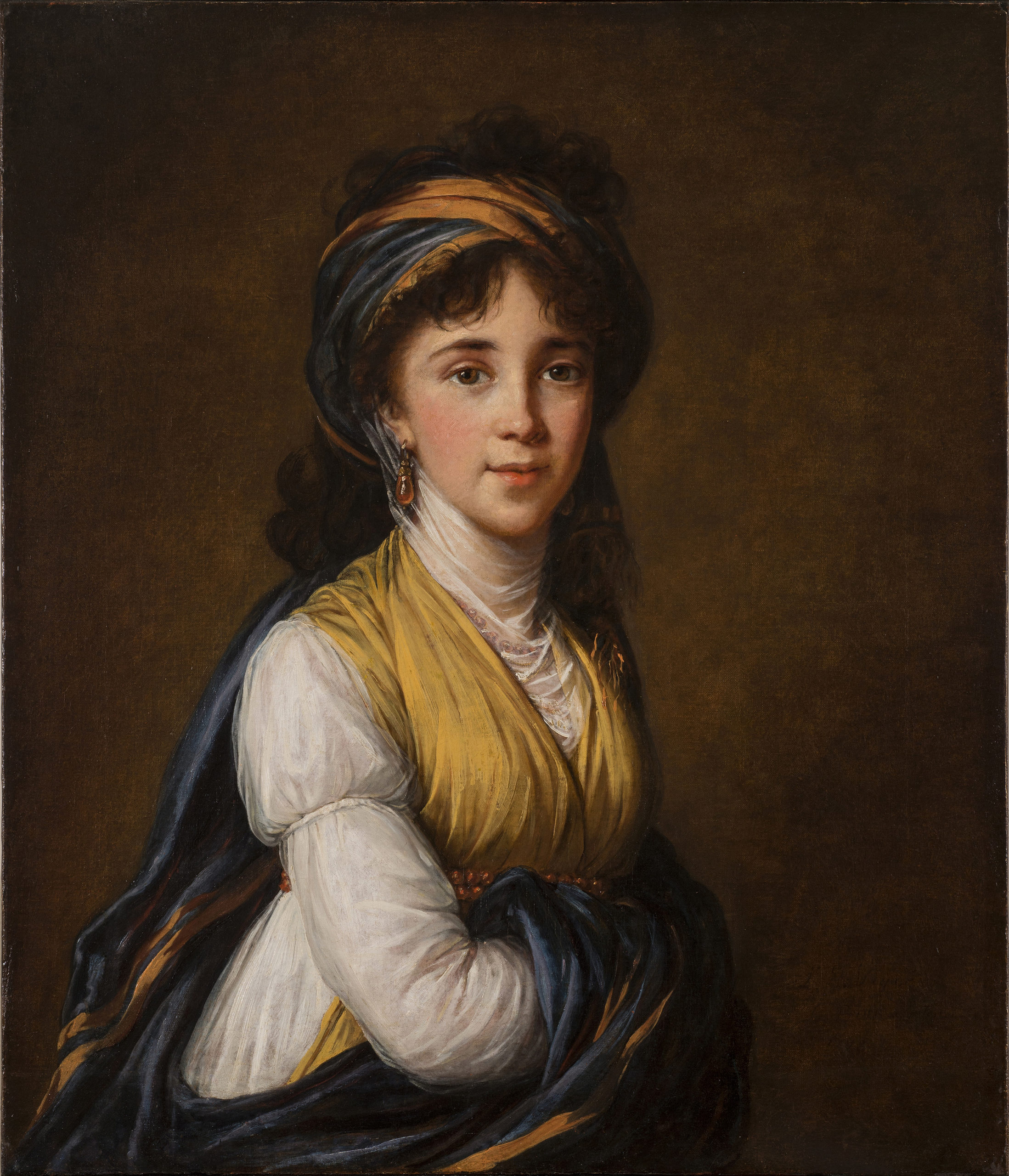 Realistically rendered half-portrait of a light-skinned young woman, gazing directly at the viewer with a faint smile on her lips. Her dark, curly hair is attractively tousled, secured under a turban-like headdress which matches her gold and blue draped ensemble.