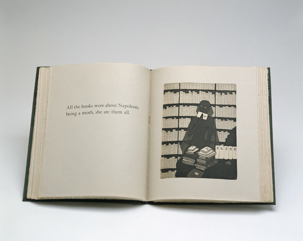 Book opened to a print illustration depicting a shadowy female figure sitting in front of bookcases. Seated at a table full of books, she holds a piece of paper to her mouth. The opposing page reads, 