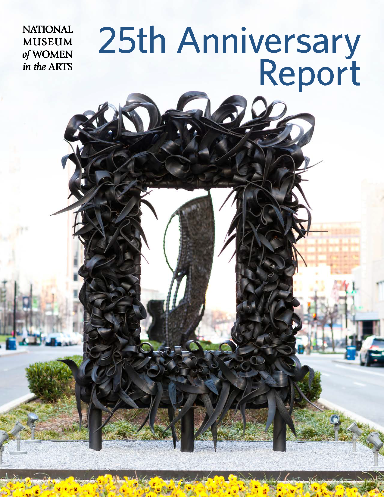 Cover of the 2013 annual report shows a large sculpture made of cut and shaped tires in the shape of a picture frame with the text '25th Anniversary Report'