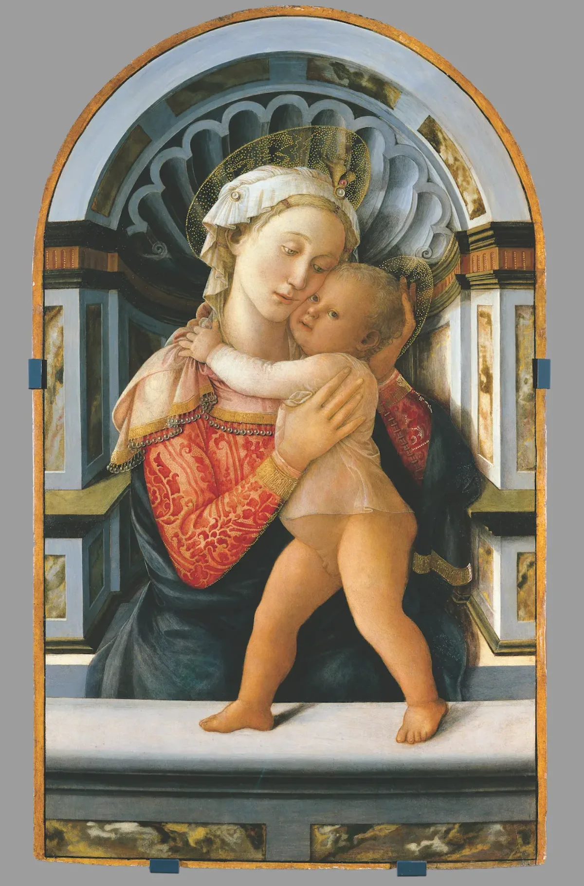 Early Renaissance style portrait depicting Mary and baby Jesus set against a Classical niche background. The image shows the faces of a light-skinned woman and baby, cheek-to-cheek in an embrace, with delicate golden halos framing their heads.