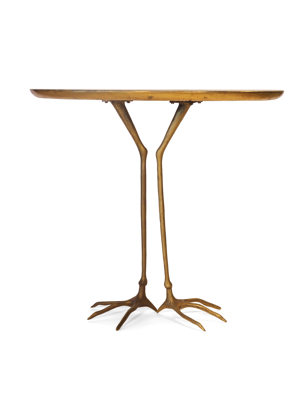 Surrealist sculpture and functional occasional table shown from the side, the work features realistic cast bronze crane legs holding a round wooden, gold-plated tabletop.