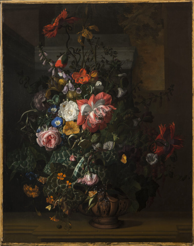 An elaborate floral arrangement painted with precise detail appears dramatically spot lit against a dark background. Large red and pink blooms dominate, interspersed with small yellow, white, and blue blossoms and varied foliage. Moths and other insects animate the bouquet.