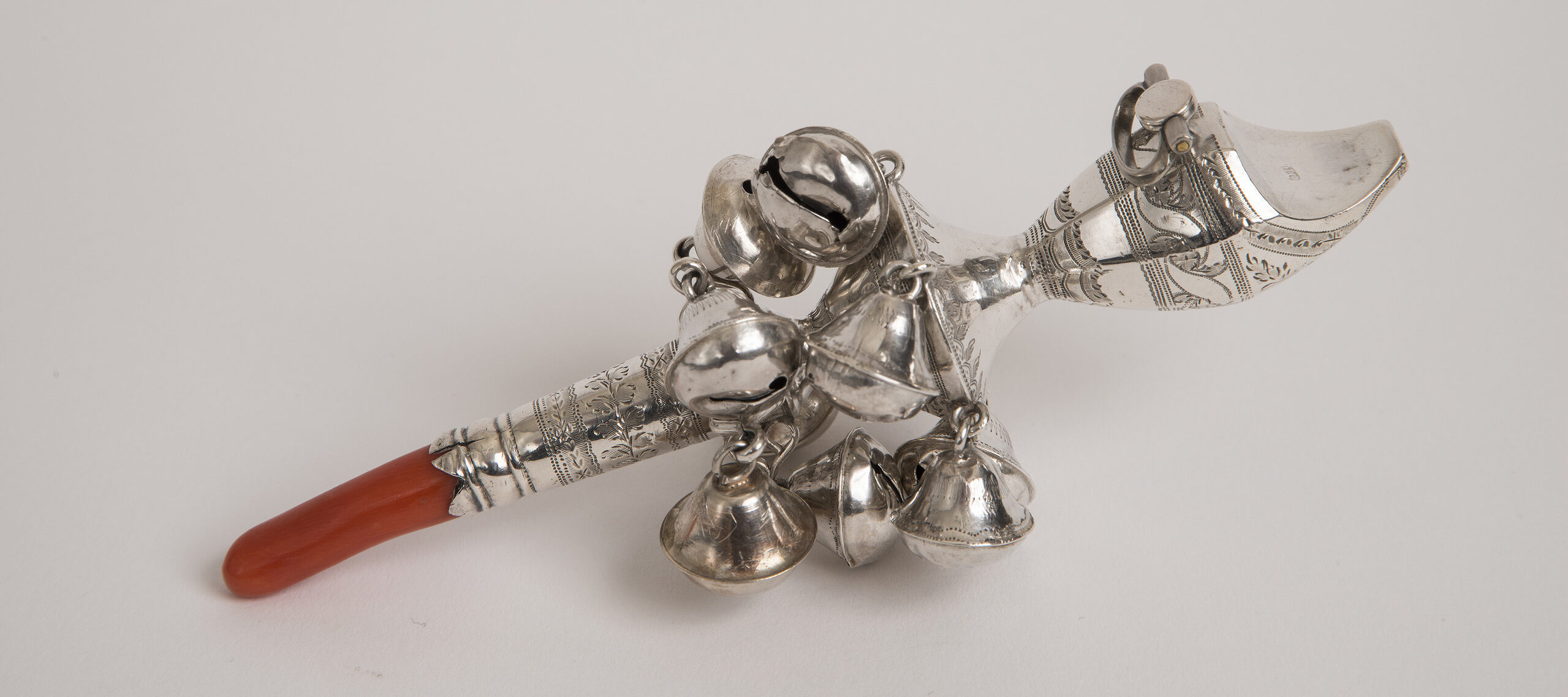 Mary Ann Croswell, George III child's rattle, 1808; Silver with coral, 5 3/8 in.; National Museum of Women in the Arts, Silver collection assembled by Nancy Valentine, purchased with funds donated by Mr. and Mrs. Oliver R. Grace and family; Photo by Lee Stalsworth