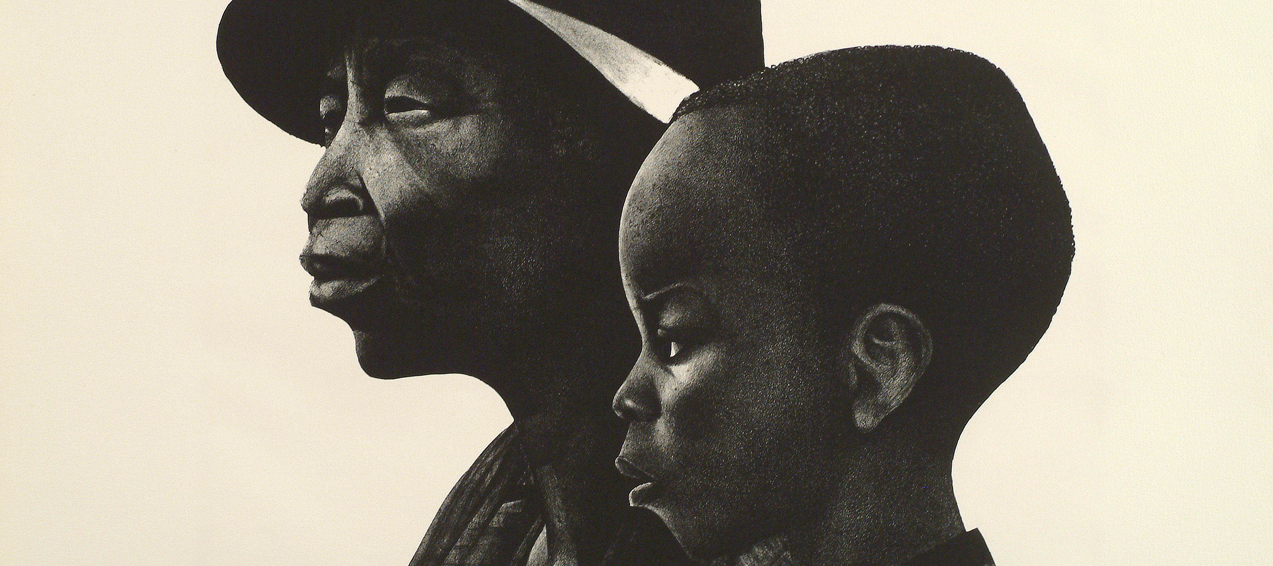 A black-and-white print of two dark-skinned individuals in profile, facing left. The person in the background is an older adult wearing a brimmed hat, and in the foreground and slightly to the right is a young child with coarse hair cut close to the head.