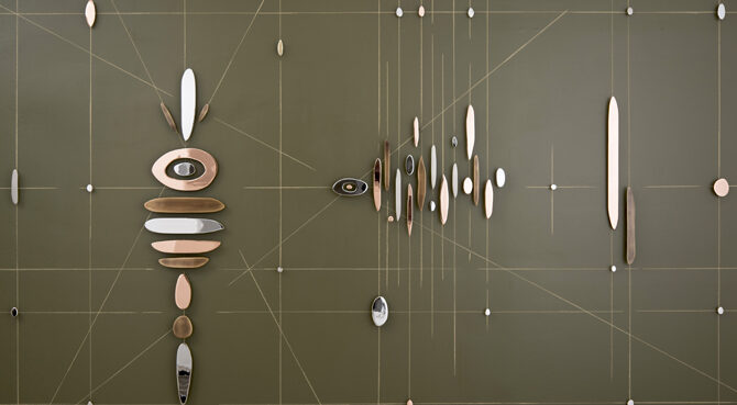 Abstract wall sculpture featuring horizontal, vertical, and diagonal intersecting lines overlaid with pieces of rounded, plated steel