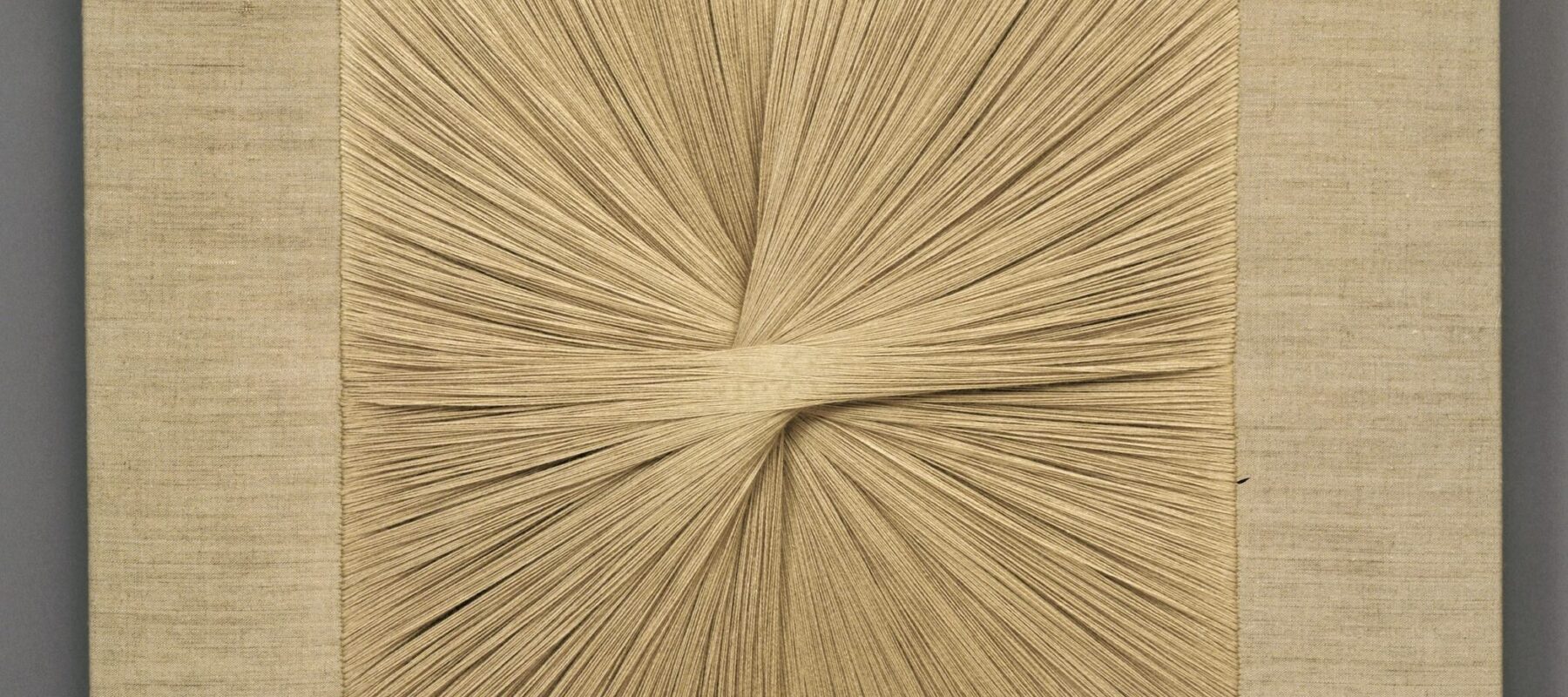 Square textile panel uses beige thread to create a starburst pattern as the central focus.