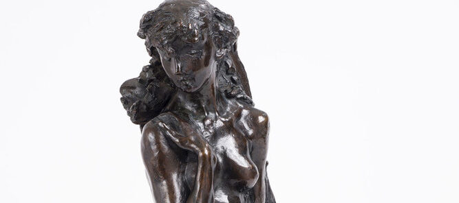Bronze tabletop sculpture depicting a nude young woman seated on rough-hewn base.leaning against a sheaf of wheat, The figure's knees are drawn together, her left arm hanging at her side and her right arm bent upwards, clasping her shoulder.