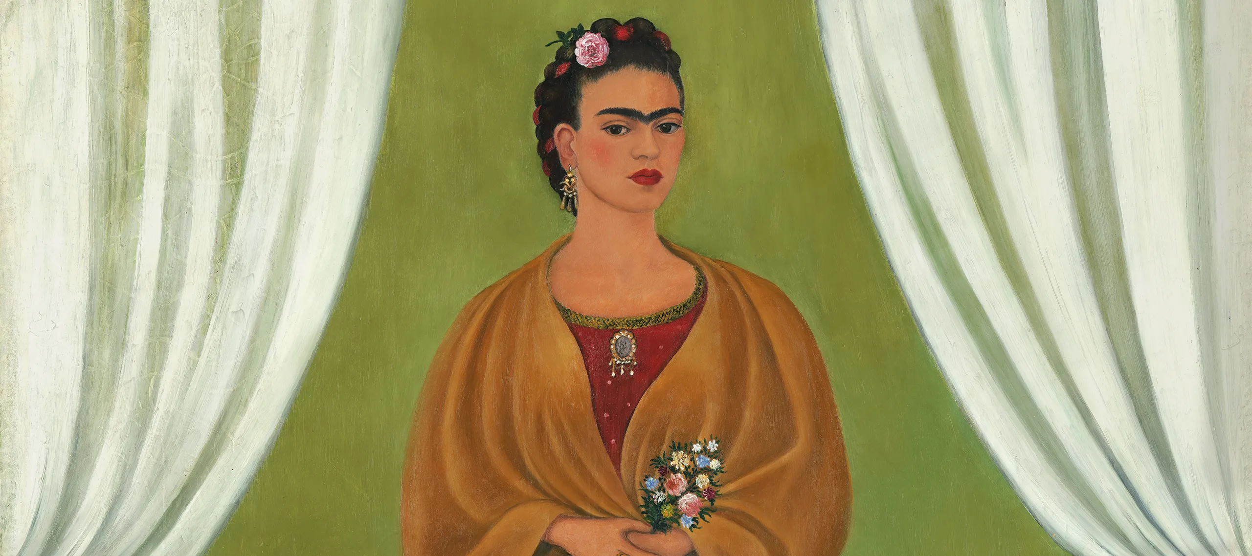 In a painted self-portrait, the artist stands in a stage-like space framed by white curtains. Beneath black hair woven with red yarn and flowers, heavy brows accent her dark-eyed gaze. Clad in a fringed, honey-toned shawl; long, pink skirt; and gold jewelry, she holds a bouquet and a handwritten letter.