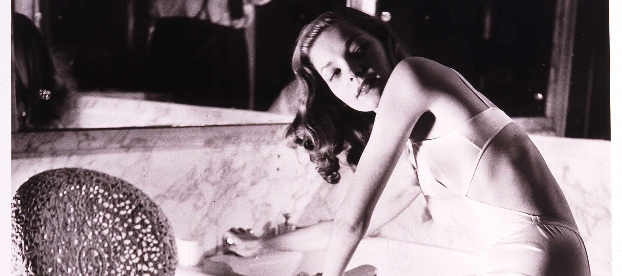 Louise Dahl-Wolfe, <i>Lauren Bacall in Helena Rubinstein's Bathroom</i>, 1943; Gelatin silver print, 14 x 11 in.; National Museum of Women in the Arts, Gift of Helen Cumming Ziegler; Photograph by Louise Dahl-Wolfe © 1989 Center for Creative Photography, Arizona Board of Regents