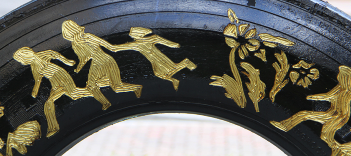 Betsabeé Romero, <i>Huellas y cicatricez (Traces and scars)</i> (detail), 2018; Four tires with engraving and gold leaf and steel support, approx. 192 1/2 x 86 5/8 x 9 3/4 in.; Courtesy Betsabeé Romero Art Studio; Photo by Mara Kurlandsky, NMWA