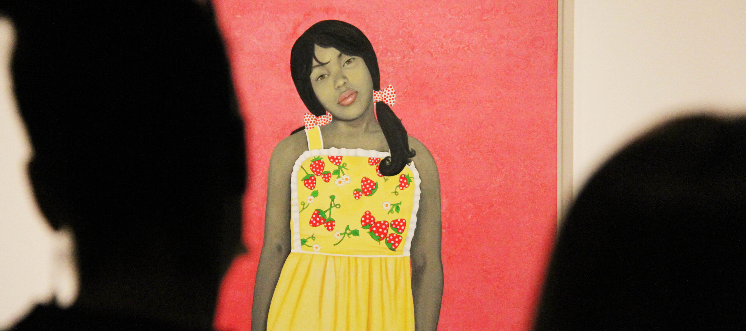 Vibrant painting of a young lady with medium skin tone staring out against a bright pink background. The painting is partially obscured by the silhouetted heads of museum visitors.