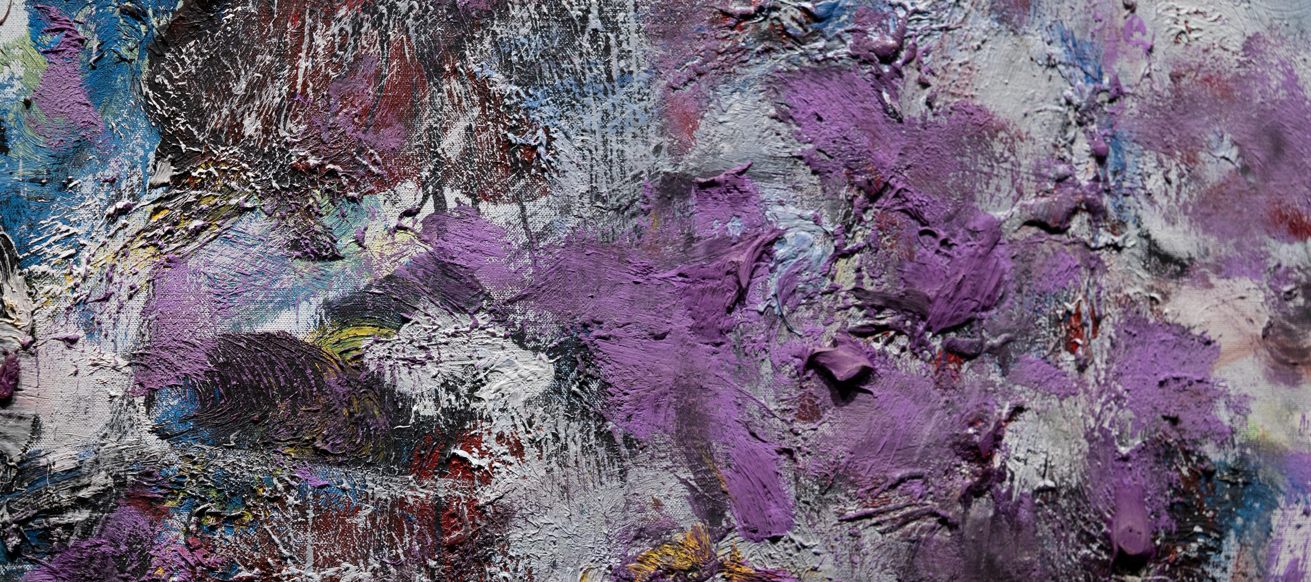 Close-up detail of an abstract painting that features dense and chaotic brushstrokes of pale gray, lavender, and cobalt.