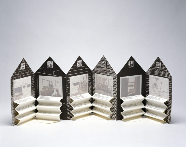 An open accordion-style book in the shape of a house. On each page is a black and white graphic background and a washed-out black and white photograph. Beneath each image is typed text on accordion folded paper.