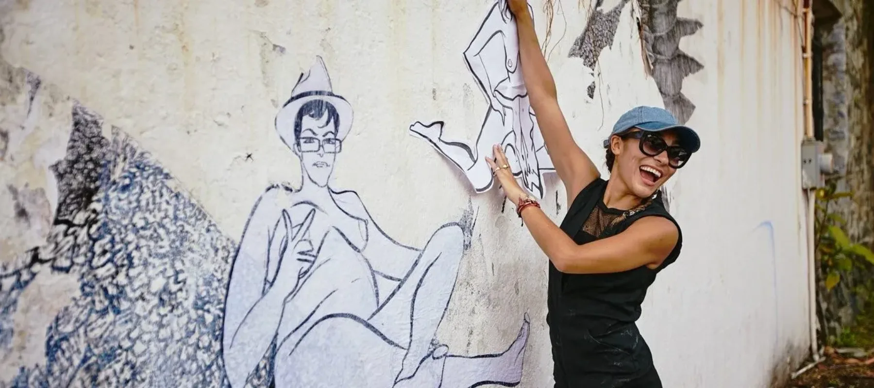 Artist Scarlett Baily at work on a mural