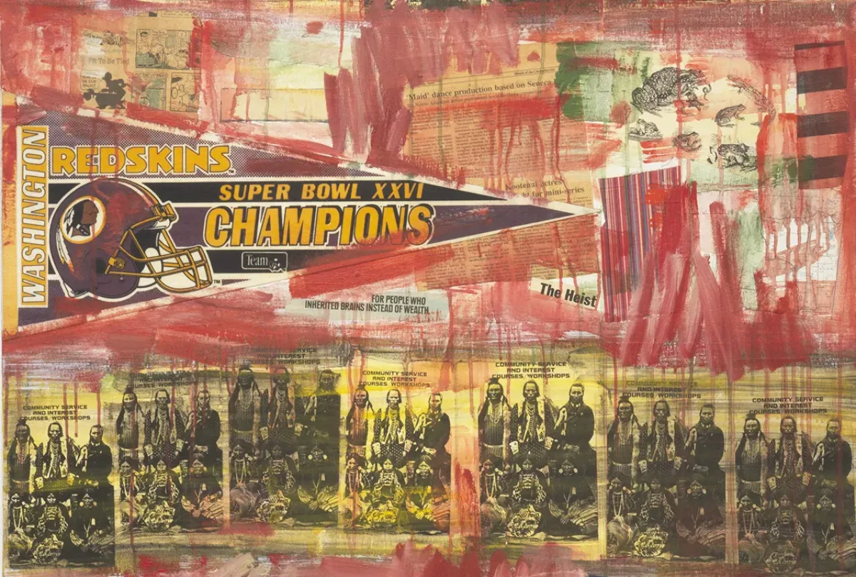 Hasty red strokes and drips of paint are overlaid on a collage of old newspaper clippings, including an image of Native American men in children in traditional dress that is repeated seven times in a row. Above these images, a fan flag for the Washington Redskins is affixed, showing the image of a football helmet with the racist logo and the words "Super Bowl XXVI Champions."