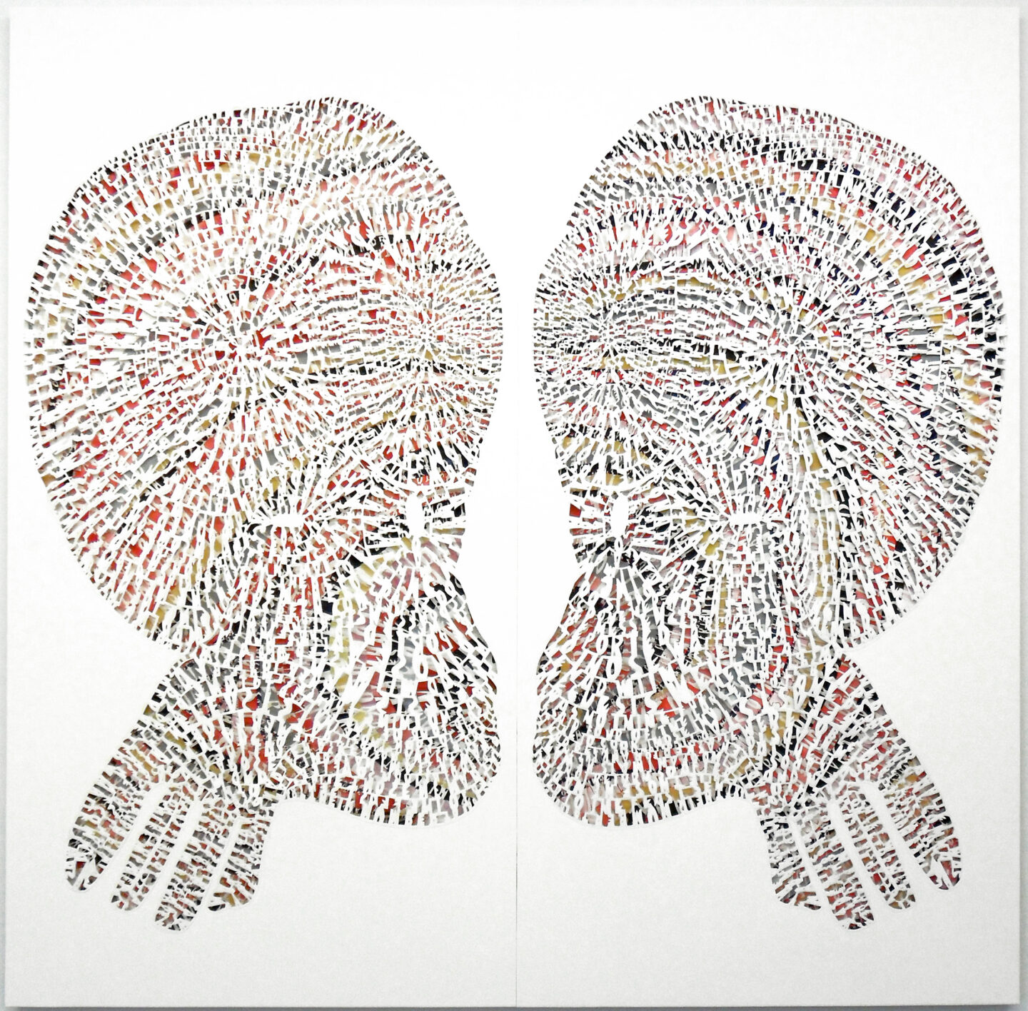 Two symmetrical forms that appear as heads with enlarged crania face each other. A colorful background for the heads peek through behind thousands of cut paper letters.