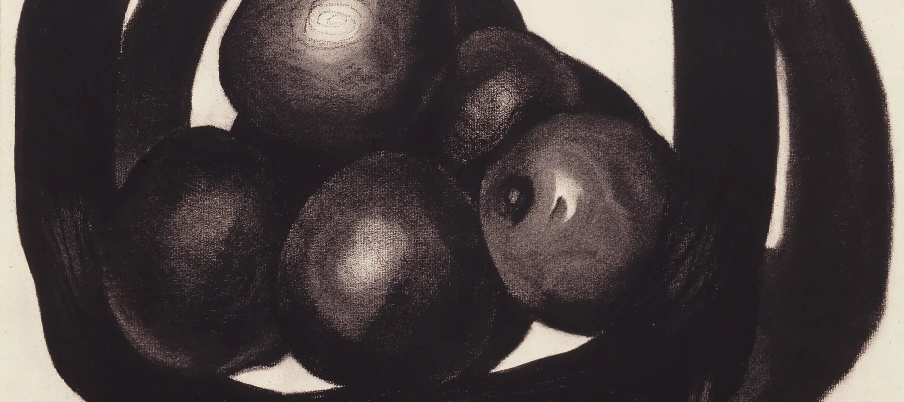 A still life of avocados in a basket rendered in charcoal on a white ground uses radically simplified forms. Two offset circles evoke a basket and its shadow. Within the circles, ovals highlighted to imply 3 dimensions, seem to hover above, not sit within, the basket interior.