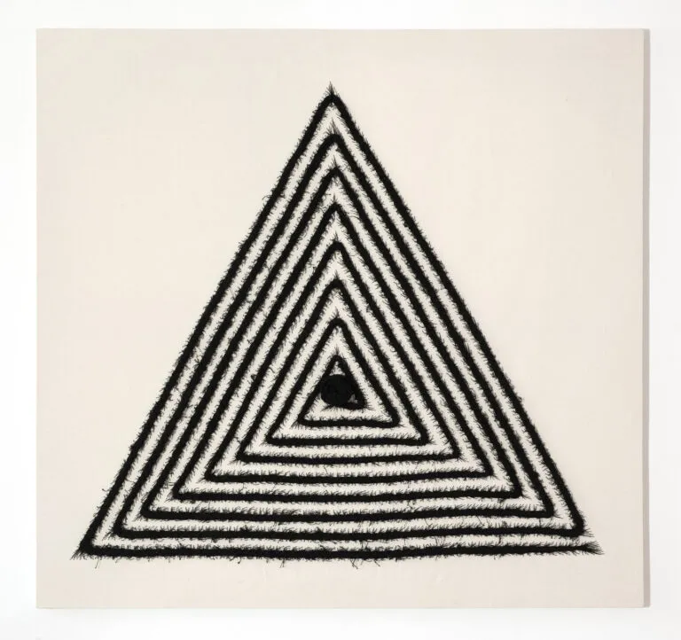 An off-white, square canvas with a large equilateral triangle in the center made from stitched black cotton thread. The thread has been braided, as a cornrow, in a triangular spiraling patter than ends with a large knot in the center of the triangle.