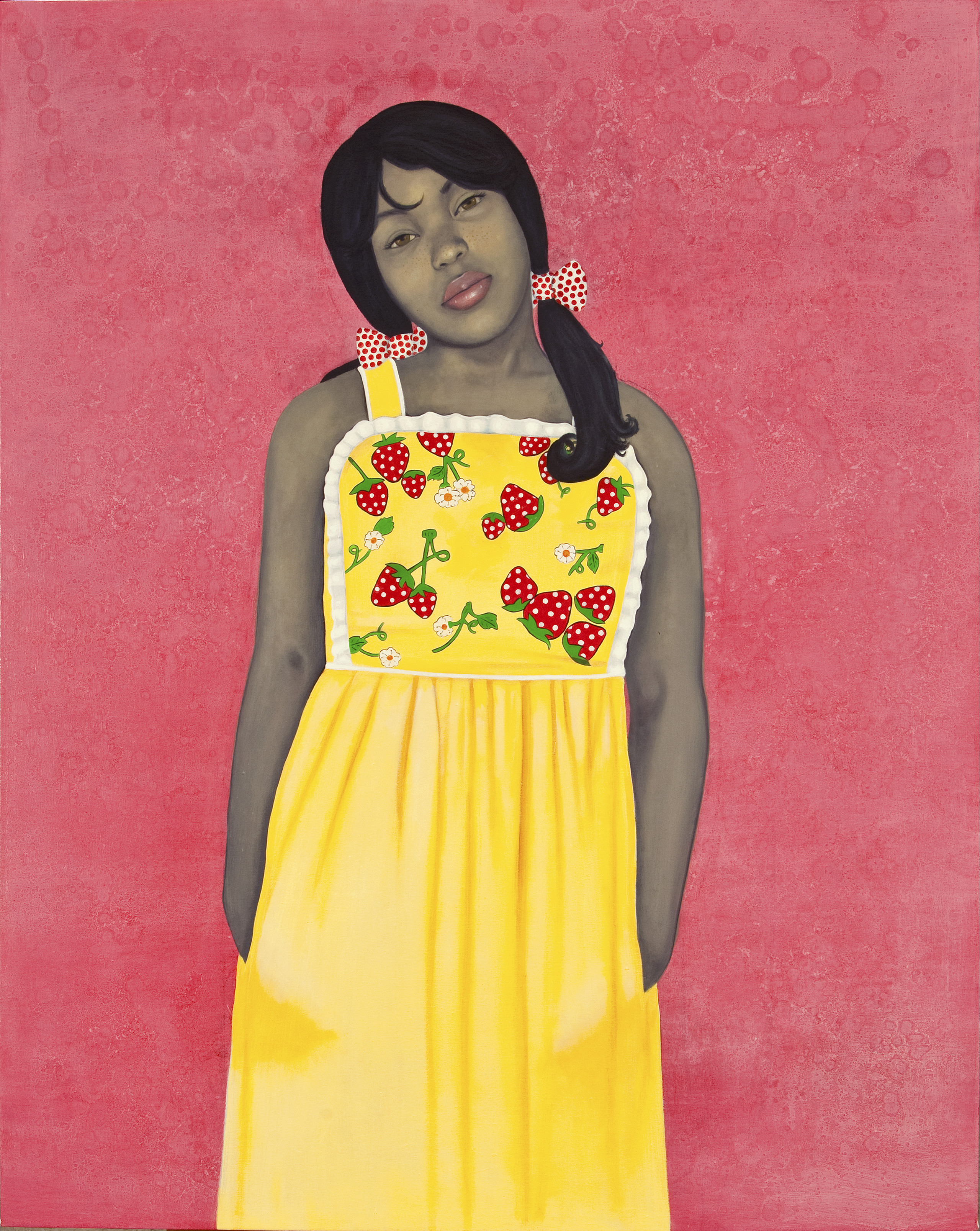 Wearing a bright yellow apron-style dress with strawberries and lace-trim details, an expressionless young woman with medium-dark skin tone rendered in grayscale stares out with her hands in her dress pockets. Her head is cocked to one side against an intensely pink-colored background.