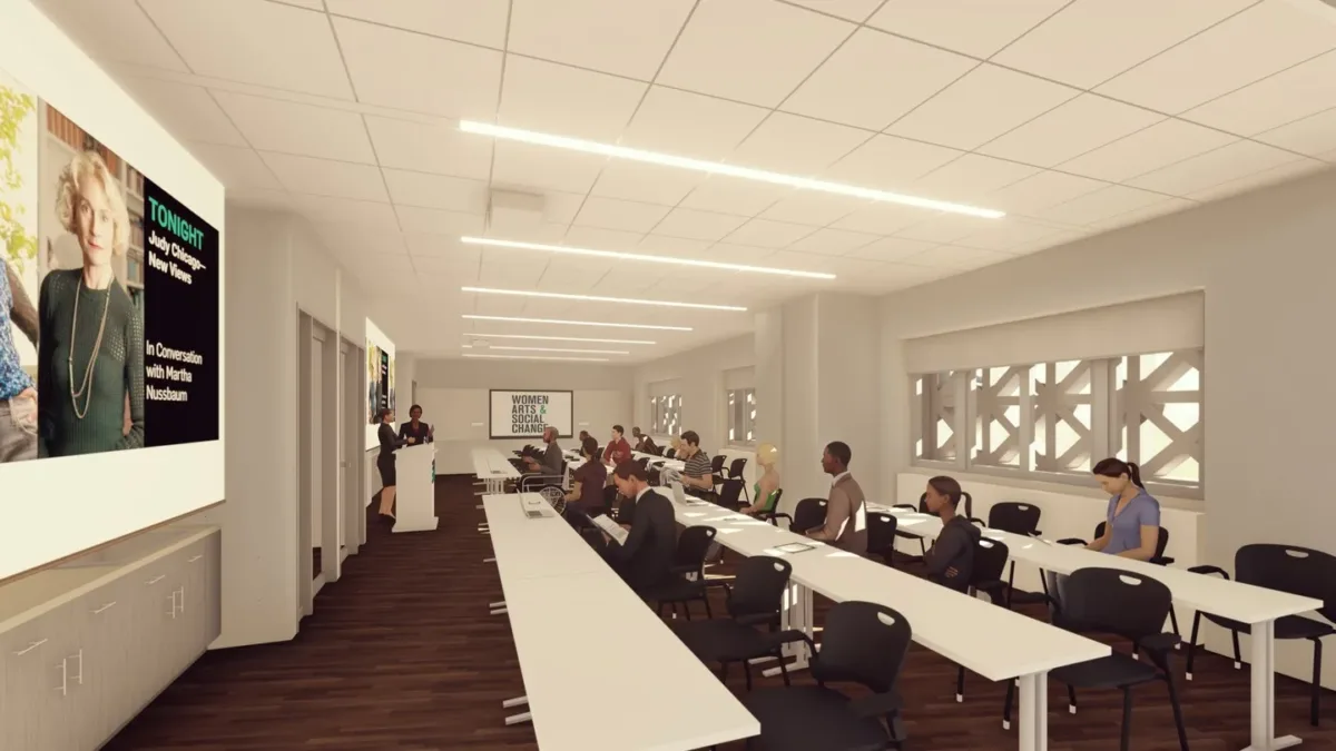 Rendering of the education studio with three rows of long tables and people sitting in lecture-style seating.