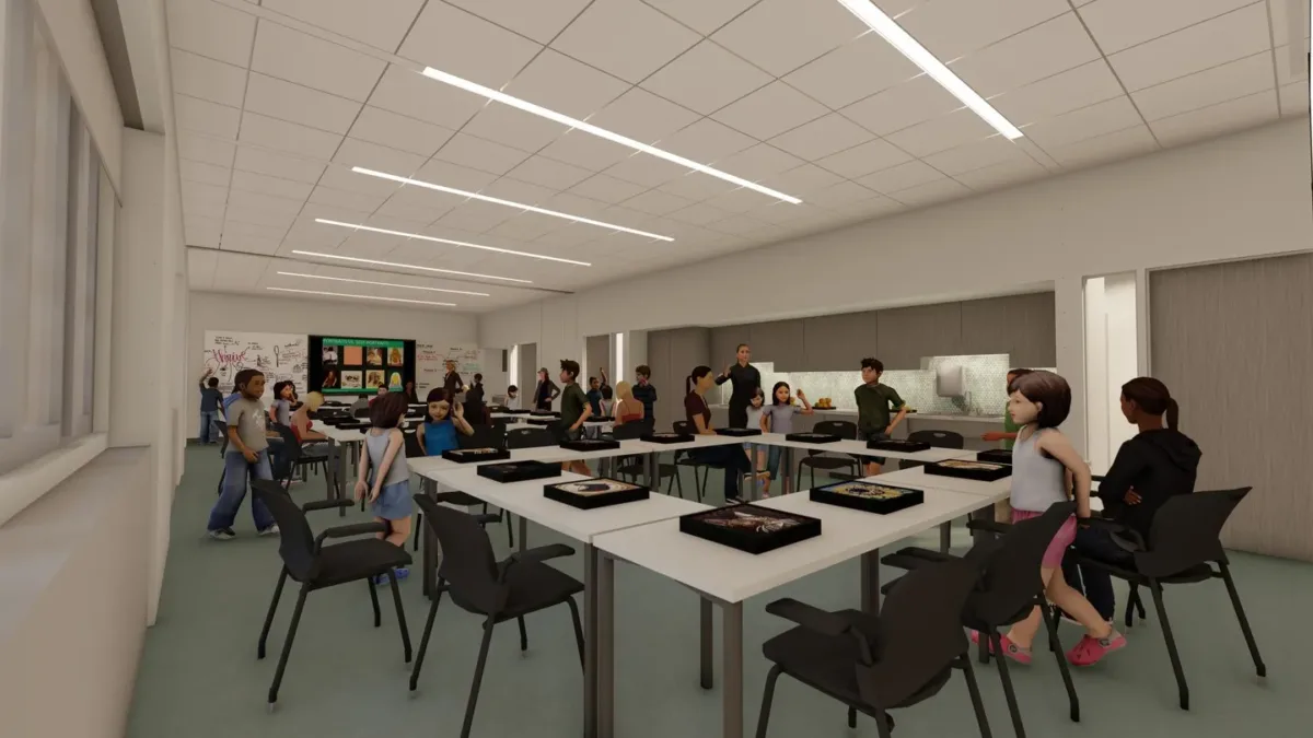 Architectural rendering of the education studio filled with tables, chairs, and people of all ages.