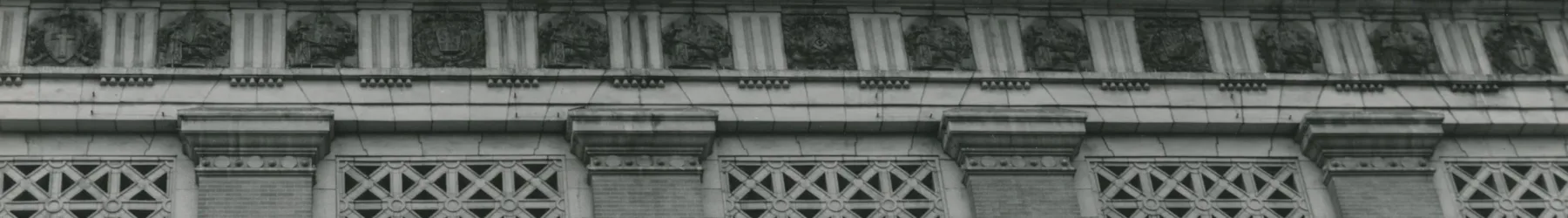 Black and white photograph of the museum exterior with a view of the upper half of the facade.