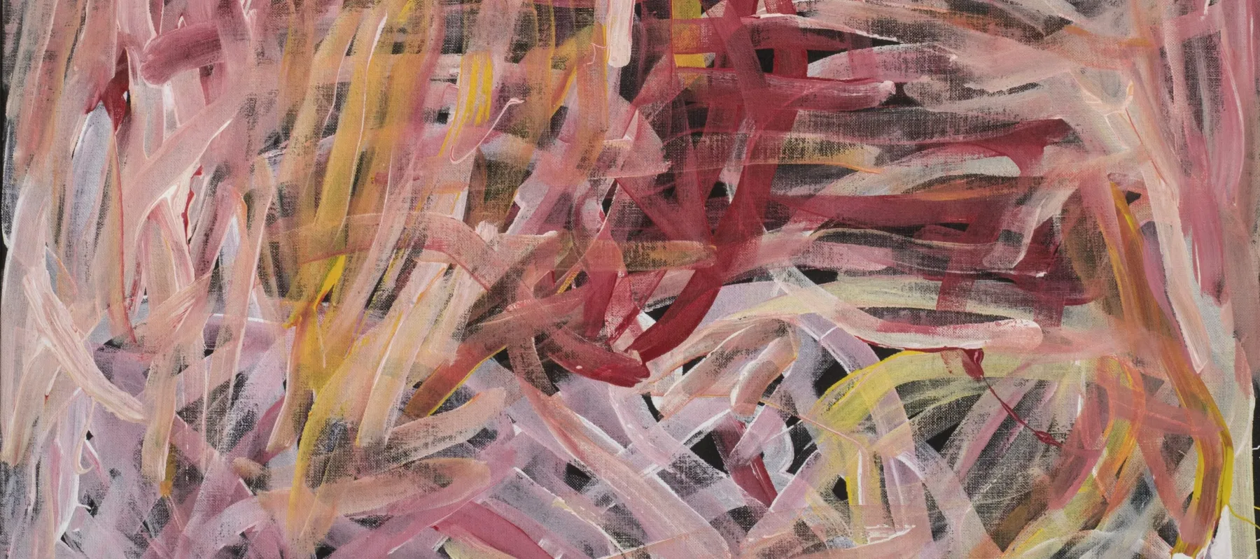 Abstract painting of long, layered brushstrokes in shades of red, pink, orange and white, laid over a black background. The brushstrokes intersect, weave together, and overlap, creating a frenzied web of lines.